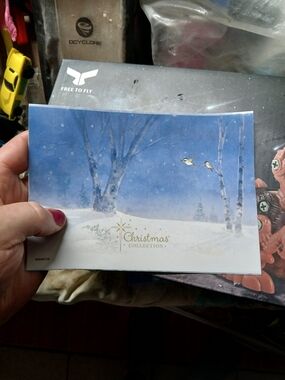 O Holy Night Christmas card features a wintery woodland scene with a fawn and bi